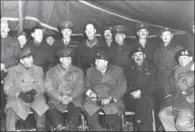  ??  ?? G.R.D. Farmer, back row, second from the right, in Germany in 1945 with group including Prime Minister Winston Churchill, Field Marshal Bernard Montgomery and Canadian generals Harry Crerar and Guy Simmonds.