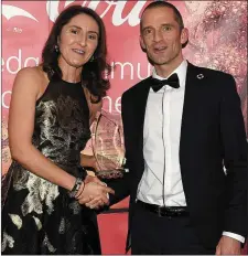  ??  ?? Jennifer Brennan presents the Sports Star of the Year award to Mark O’Shea in the Westcourt Hotel on Saturday night.