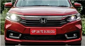  ??  ?? Revised front end sports a new grille, automatic LED projector headlamps with LED DRLs as well as LED fog lamps. Tail lamps feature a C-shape LED motif along with an LED stop lamp. Both front and rear bumpers get a dose of chrome
1&2
