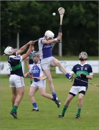  ??  ?? George O’Brien of St Patrick’s is challenged by Diarmuid Masterson of Bray Emmets.