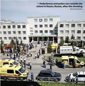  ?? Roman Kruchinin ?? > Ambulances and police cars outside the school in Kazan, Russia, after the shooting
