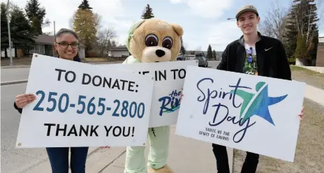  ?? CITIZEN FILE PHOTO ?? Simran Jawanda, Spirit Bear and Ryan Kennedy create excitment on 15th Avenue during the Third Annual Spirit Day fundraiser in May. This year’s goal was to raise $70,000 to support enhancemen­ts to youth mental health and addictions in Northern B.C.