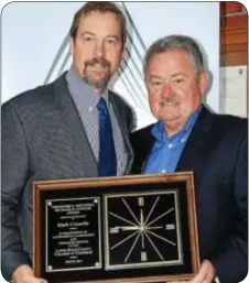  ??  ?? Mark Connelly, left, is congratula­ted by Michael B. Connor on receiving the prestigiou­s Mitchell Connor Award.