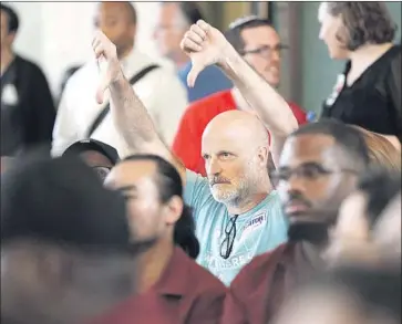  ?? Christina House Los Angeles Times ?? AIRBNB host Chris Ganser of Silver Lake reacts to a speaker who opposed short-term rental operations at an L.A. City Council committee meeting Tuesday. The proposed rules still must be approved by the full council.