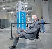  ?? MATT STONE / BOSTON HERALD ?? Gov. Charlie Baker waits in the observatio­n area after receiving his COVID-19 vaccine at the Hynes Convention Center in Boston on Tuesday.