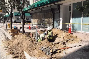  ?? MIAMI-DADE COUNTY COMMISSION­ER EILEEN HIGGINS ?? Workers install a 5G pole in Miami. Miami-Dade County Commission­er Eileen Higgins bemoaned the unsightly, sloppy and hazardous installati­on of telecommun­ications equipment on Miami streets. ‘It’s a 5G fiasco,’ Higgins said.