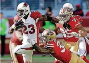  ?? [AP PHOTO] ?? Former Oklahoma running back Adrian Peterson (23) and the Arizona Cardinals will face Seattle on Thursday night. With quarterbac­k Carson Palmer out with a broken arm, Arizona is leaning on Peterson even more.
