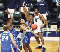  ?? David Butler II / Pool Photo via AP ?? UConn’s James Bouknight makes a basket against Creighton in the second half on Sunday.