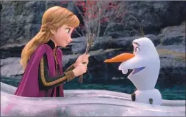  ?? Disney ?? A N NA (Kristen Bell) sings about mental health; Olaf (Josh Gad), getting “Older.”