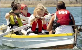  ??  ?? Members of Killurin Rowing Club racing on the day.