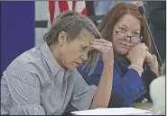  ?? AP/South Florida Sun-Sentinel/JOE CAVARETTA ?? Judges Betsy Benson (left) and Deborah Carpenter Toye, of the canvassing board, react to an 11th hour paperwork delay on Sunday, at the Broward Supervisor of Elections office in Lauderhill, Fla.