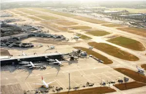  ??  ?? Aircrafts taxi along the perimeter of the north runway, center, and past passenger terminal buildings at London Heathrow Airport, in this aerial photograph taken over London, UK. (Bloomberg)