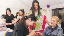  ??  ?? On the occasion of Mother’s Day celebratio­n, Casa Antonia’s female residents were treated to hair and beauty treatments. Picture shows Dr Sarah Cassar overseeing the beauty treatments