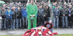  ?? WILLIAM CHERRY ?? Northern Ireland fans hold their Remembranc­e service in Basel