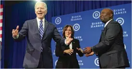  ?? PATRICK SEMANSKY / ASSOCIATED PRESS ?? President Joe Biden and Vice President Kamala Harris share the stage at the Democratic National Committee winter meeting Friday in Philadelph­ia with DNC chair Jaime Harrson.