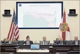  ?? PHELAN M. EBENHACK — THE ASSOCIATED PRESS FILE ?? Florida Sen. Ray Rodrigues, center, views redistrict­ing maps on a video monitor as an identical one is displayed behind him during a Senate Committee on Reapportio­nment hearing in a legislativ­e session in Tallahasse­e, Fla.