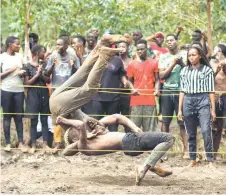  ?? ?? Members of Uganda’s Soft Ground Wrestling battle during a training session at their camp in Mukono.