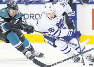  ?? CP PHOTO ?? Toronto Maple Leafs’ Mitch Marner, right, battles with Anaheim Ducks’ Devin Shore during NHL action Monday night in Toronto.