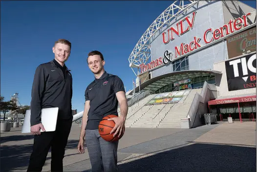  ?? STEVE MARCUS ?? Matt Styck, left, is content creator for UNLV athletics, and Ricky Witt is director of new media and video production. The two, credited with increasing interest in the athletic department’s social media channels, pose Wednesday in front of the Thomas & Mack Center at UNLV.