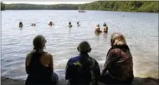  ?? STEVEN SENNE — THE ASSOCIATED PRESS FILE ?? People enjoy an afternoon at Walden Pond in Concord, Mass.