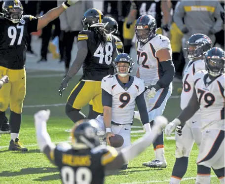  ?? Andy Cross, The Denver Post ?? Denver quarterbac­k Jeff Driskel ( 9) comes back up after being sacked by Pittsburgh strong safety Terrell Edmunds ( not pictured) on fourth- and- 2 with less than two minutes in the game at Heinz Field on Sunday in Pittsburgh.