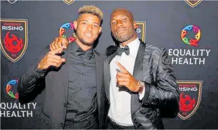  ?? Photo / Supplied ?? Expat Whanganui footballer James Musa (left) reunites with his Phoenix Rising boss, legendary Chelsea and Ivory Coast striker Didier Drogba, after re-signing with the Arizona team for the 2019 season.