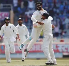  ?? Reuters ?? Indian spinner Ravindra Jadeja celebrates the dismissal of Australian captain and dangerman Steve Smith yesterday.