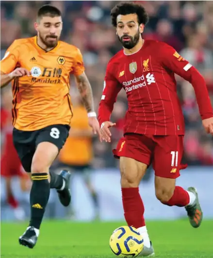  ?? Photo: Reuters ?? Liverpool’s Mohamed Salah (with ball) in action against Wolves in the English Premier League at Anfield Stadium in Liverpool, England on December 30, 2019.