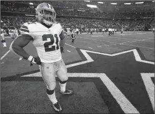  ?? The Associated Press ?? : Dallas Cowboys' Ezekiel Elliott stands on the field after their 35-31 loss to the Green Bay Packers in a NFL football game in Arlington, Texas, on Sunday.