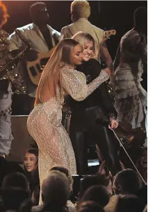  ?? GETTY IMAGES/FILES ?? Beyoncé played Daddy Lessons with the Dixie Chicks, including Martie Maguire, at the Country Music Associatio­n Awards in November, prompting complaints from country star Travis Tritt.