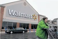  ?? Steven Senne / Associated Press ?? Walmart employees are gearing up for a major labor action over low wages, high health care premiums and other issues.