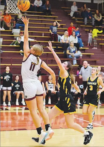  ?? Westside Eagle Observer/RANDY MOLL ?? Kaitlyn Caswell, a Gentry junior, shoots from under the basket during play against Prairie Grove on Dec. 20 in Gentry.