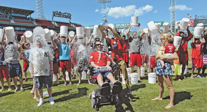  ?? STAFF FILE PHOTO, ABOVE, BY ARTHUR POLLOCK; STAFF PHOTO, BELOW, BY CHRISTOPHE­R EVANS ?? COOL DISCOVERY: Dr. John Landers, below, led a study — funded in part by Pete Frates’ Ice Bucket Challenge, seen above in 2015 — which identified a gene said to be responsibl­e for a type of early onset ALS.