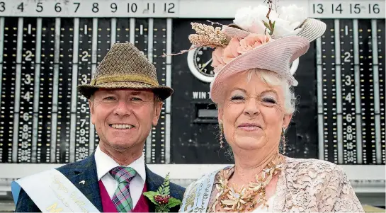  ?? PHOTOS: MAARTEN HOLL/FAIRFAX NZ ?? John Morrow and partner Lynne Rait both won their respective Fashion In The Field sections – Best Dressed Man and Classic Lady – at Wellington Cup Day on Saturday.