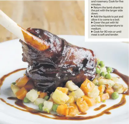  ??  ?? MOUTHWATER­ING. Glazed roast lamb shank on a bed of chopped vegetables.