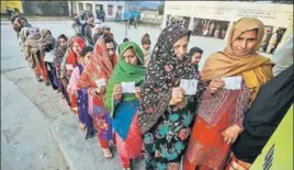  ?? PTI ?? Voters stand in a queue to cast their votes in phase 8 of the panchayat elections at Bajalta village in Jammu on Saturday.