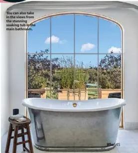  ??  ?? You can also take in the views from the stunning soaking tub in the main bathroom.