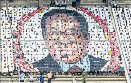  ?? Photo: Jekesai Njikizana/AFP ?? Waiting for uhuru: The Independen­ce Day celebratio­ns in Zimbabwe couldn’t mask the fact that President Robert Mugabe’s promised economic liberation has yet to materialis­e.