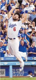  ?? CHRIS CARLSON/ASSOCIATED PRESS ?? Charlie Culberson of the Dodgers celebrates after he hit a game-winning homer in the 10th inning.