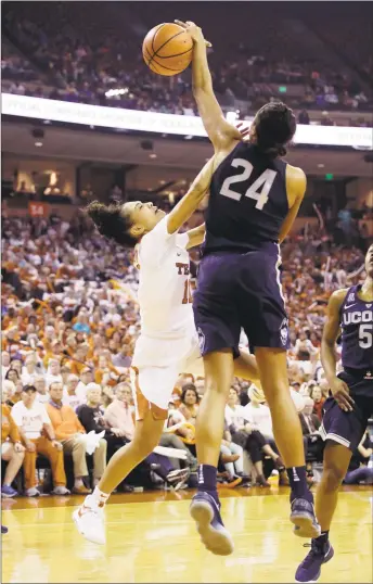  ?? Eric Gay / Associated Press ?? Texas guard Brooke McCarty is blocked by UConn’s Napheesa Collier (24) in the first half Monday in Austin, Texas.