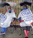  ?? Yehyun Kim / CTMirror.org ?? Calla Contos, left, and Cyanna Johnson, nurses at Backus Hospital, participat­e in the strike on Tuesday outside of the hospital in Norwich.