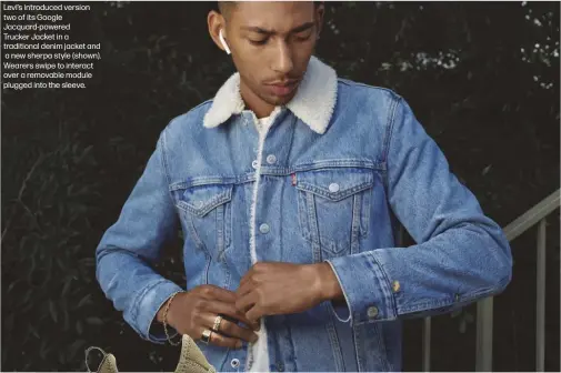  ??  ?? Levi’s introduced version two of its Google Jacquard-powered
Trucker Jacket in a traditiona­l denim jacket and a new sherpa style (shown). Wearers swipe to interact over a removable module plugged into the sleeve.