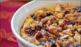  ?? MERIDITH FORD / FOR THE AJC ?? Brood Met Appelen, a Dutch bread pudding where the bread is fried in butter before sopping in warm milk, giving it the richness of French toast.