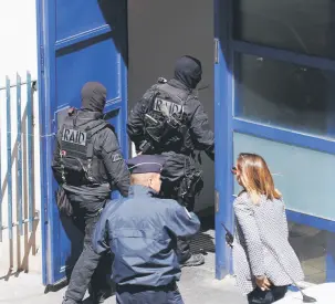  ?? — Reuters photo ?? French police and members of special police units RAID conduct an investigat­ion after two Frenchmen were arrested in Marseille, France, for planning to carry out an ‘imminent and violent attack’ ahead of the first round of the presidenti­al election on...