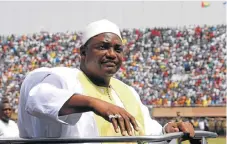  ?? /AFP Photo ?? Oath of office: New Gambian President Adama Barrow greets the crowds as he arrives at Independen­ce Stadium in Bakau, west of the capital Banjul, for the inaugurati­on ceremony on Saturday.