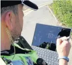  ??  ?? Cheshire Police is rolling out the use of computer tablets to officers