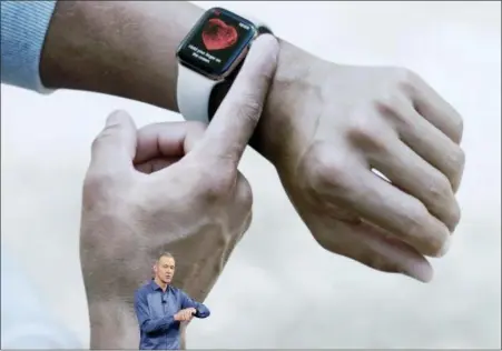  ?? ASSOCIATED PRESS ?? Jeff Williams, Apple’s chief operating officer, speaks about the Apple Watch Series 4 at the Steve Jobs Theater during an event to announce new Apple products Wednesday, Sept. 12, 2018, in Cupertino, Calif.