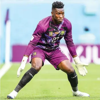  ?? ?? Cameroon's goalkeeper Andre Onana eyes the ball during the World Cup group G soccer match between Switzerlan­d and Cameroon, at the Al Janoub Stadium in Al Wakrah, Qatar, Thursday, Nov. 24, 2022. (AP Photo/Petr Josek)