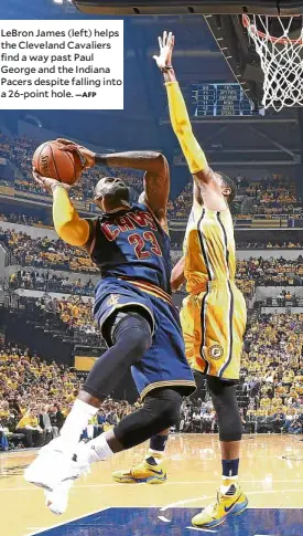  ?? —AFP ?? LeBron James (left) helps the Cleveland Cavaliers find a way past Paul George and the Indiana Pacers despite falling into a 26-point hole.