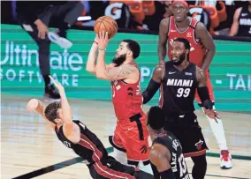  ?? ASHLEY LANDIS/POOL PHOTO/USA TODAY SPORTS ?? The Raptors’ Fred VanVleet (23) shoots as the Heat’s Goran Dragic tries to draw the offensive foul during the second half on Monday.